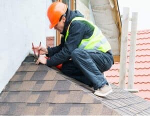 Man repairing roof.